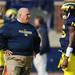 Michigan offensive coordinator Al Borges chats with junior quarterback Denard Robinson during warm-ups. Melanie Maxwell I AnnArbor.com